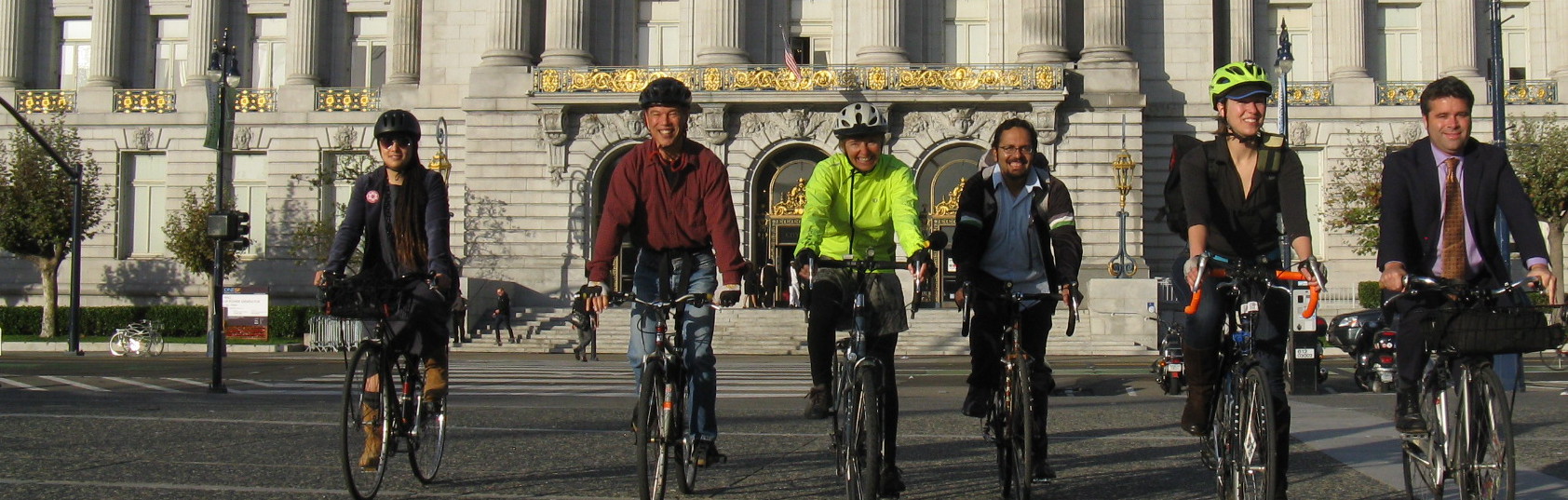 SF Bicycle Coalition members riding together in front of San Francisco City Hall