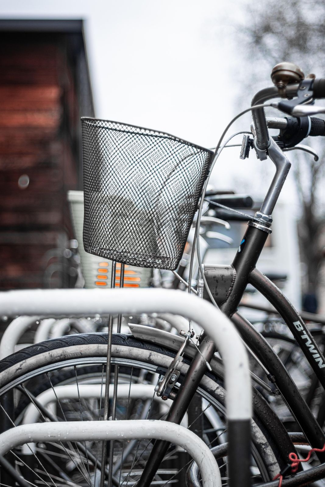 Rows of parked bicycles lined up in city bike racks