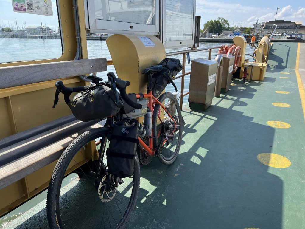 Loaded touring bicycles parked in the bike area of a passenger train